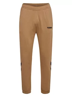 Spodnie sportowe męskie - Hummel Spodnie dresowe "Legacy" w kolorze jasnobrązowym - grafika 1