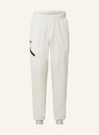Koszulki i topy damskie - Under Armour Spodnie Treningowe Unstoppable beige - miniaturka - grafika 1