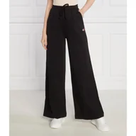 Dresy damskie - Tommy Jeans Spodnie dresowe TJW XS BADGE STRT LEG | flare fit - miniaturka - grafika 1