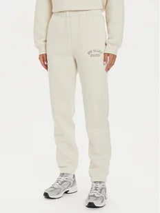 New Balance Spodnie dresowe WP43500 Beżowy Relaxed Fit - Spodnie sportowe damskie - miniaturka - grafika 1