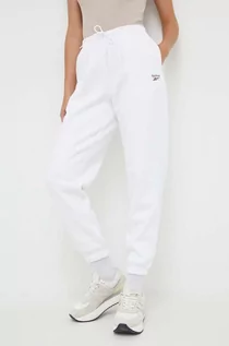 Spodnie damskie - Reebok spodnie dresowe kolor biały gładkie - grafika 1