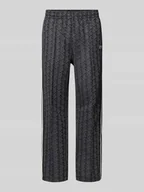 Spodnie sportowe męskie - Spodnie dresowe o kroju regular fit z dodatkiem bawełny - miniaturka - grafika 1