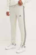 Spodnie męskie - adidas spodnie dresowe Essentials kolor beżowy z aplikacją JG5952 - miniaturka - grafika 1