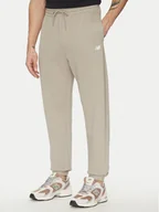 Spodnie sportowe męskie - New Balance Spodnie dresowe Essentials MP41519 Beżowy Relaxed Fit - miniaturka - grafika 1