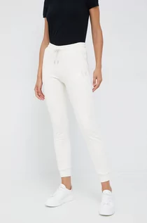 Spodnie damskie - Armani Exchange spodnie dresowe bawełniane damskie kolor beżowy gładkie - grafika 1