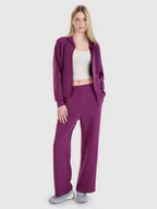Spodnie damskie - 4F Spodnie damskie dresowe z modalem z szerokimi nogawkami 4FWSS25TTROF1011-50S Fioletowy Roz. S - miniaturka - grafika 1
