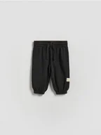 Spodenki dla niemowląt - Reserved - Bawełniane spodnie - czarny - miniaturka - grafika 1