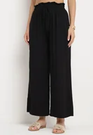 Spodnie damskie - Czarne Szerokie Bawełniane Spodnie Palazzo z Wysokim Stanem i Elastyczną Gumką w Pasie Nelonia - miniaturka - grafika 1