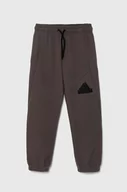 Spodnie i spodenki dla dziewczynek - adidas spodnie dresowe kolor brązowy z nadrukiem - miniaturka - grafika 1