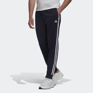 Primegreen Essentials Warm-Up Tapered 3-Stripes Track Pants - Spodnie sportowe damskie - miniaturka - grafika 1