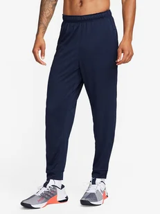 Nike Spodnie sportowe w kolorze granatowym - Spodnie sportowe męskie - miniaturka - grafika 1
