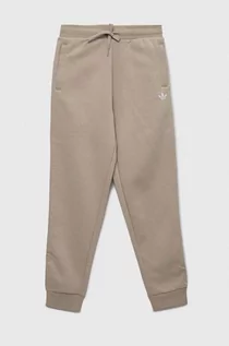 Spodnie i spodenki dla dziewczynek - adidas Originals spodnie dresowe dziecięce kolor beżowy gładkie - grafika 1