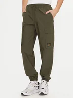 Spodnie sportowe męskie - Champion Spodnie dresowe 220415 Zielony Loose Fit - miniaturka - grafika 1