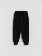 Spodnie i spodenki dla chłopców - Reserved - Dzianinowe joggery - czarny - miniaturka - grafika 1