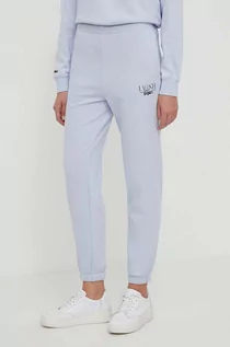 Spodnie damskie - Lacoste spodnie dresowe kolor niebieski z nadrukiem - grafika 1