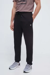 Spodnie męskie - Hummel spodnie dresowe bawełniane kolor czarny gładkie - grafika 1