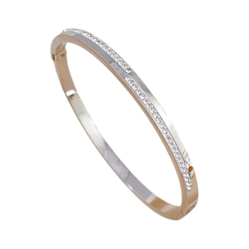 Bransoletka damska pozłacana z cyrkoniami srebny