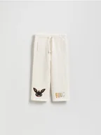 Spodnie i spodenki dla dziewczynek - Reserved - Spodnie dresowe Bing - złamana biel - miniaturka - grafika 1