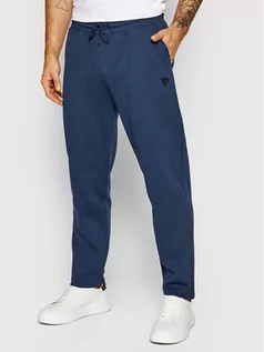 Spodnie sportowe męskie - Guess Spodnie dresowe U1BA06 JR06S Granatowy Regular Fit - grafika 1