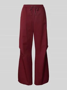 Spodnie z elastycznym pasem i trokami ściągającymi - Spodnie sportowe damskie - miniaturka - grafika 1