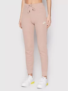 Spodnie sportowe damskie - Nike Spodnie dresowe Sportswear Essential BV4099 Różowy Slim Fit - grafika 1