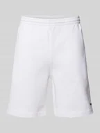 Spodnie sportowe męskie - Szorty z dzianiny dresowej o kroju regular fit z naszywką z logo - miniaturka - grafika 1