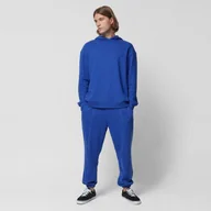 Spodnie sportowe męskie - Męskie spodnie dresowe Outhorn OTHAW23TTROM442 - chabrowe - miniaturka - grafika 1