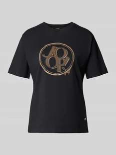 T-shirt z nadrukiem z logo model ‘Tashi’ - Koszulki i topy damskie T-shirt z nadrukiem z logo model ‘Tashi’ - Koszulki i topy damskie - miniaturka - grafika 1