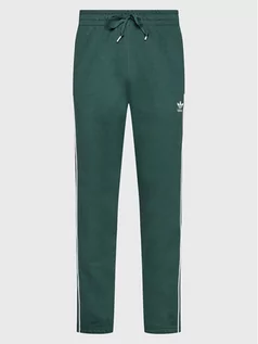 Spodnie sportowe męskie - adidas Spodnie dresowe Rekive HK7316 Zielony Regular Fit - grafika 1