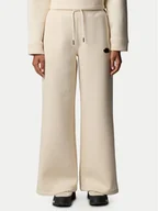 Spodnie sportowe damskie - The North Face Spodnie dresowe NF0A8C25 Beżowy Wide Leg - miniaturka - grafika 1