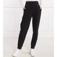 Dresy damskie - Calvin Klein Spodnie dresowe | Relaxed fit - miniaturka - grafika 1