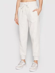 New Balance Spodnie dresowe WP21511 Beżowy Relaxed Fit - Spodnie sportowe damskie - miniaturka - grafika 1