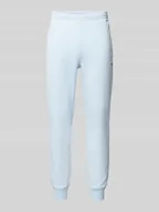 Spodnie sportowe męskie - Spodnie dresowe o kroju slim fit z naszywką z logo - miniaturka - grafika 1