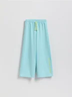 Spodnie i spodenki dla dziewczynek - Reserved - Spodnie dresowe z nadrukiem - jasnoturkusowy - miniaturka - grafika 1