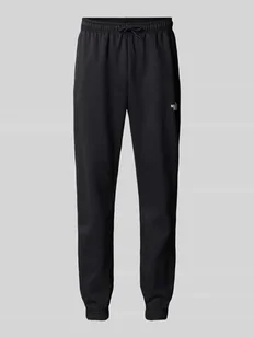 Spodnie dresowe o kroju regular tapered fit z nadrukiem z logo - Spodnie sportowe męskie - miniaturka - grafika 1
