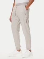 Spodnie sportowe męskie - Tommy Hilfiger Spodnie dresowe UM0UM03664 Beżowy Regular Fit - miniaturka - grafika 1