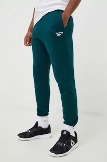 Spodnie męskie - Reebok spodnie dresowe męskie kolor zielony gładkie - grafika 1