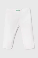 Spodnie i spodenki dla dziewczynek - United Colors of Benetton legginsy dziecięce kolor biały gładkie - miniaturka - grafika 1