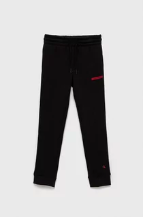 Spodnie damskie - Calvin Klein Jeans Spodnie dziecięce kolor czarny gładkie - grafika 1