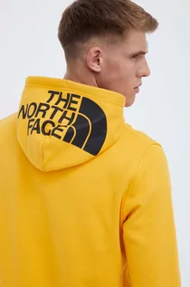 Bluzy męskie - The North Face bluza bawełniana męska kolor żółty z kapturem gładka - grafika 1