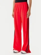 Spodnie sportowe damskie - adidas Spodnie dresowe adicolor Classic Firebird JW1227 Pomarańczowy Loose Fit - miniaturka - grafika 1