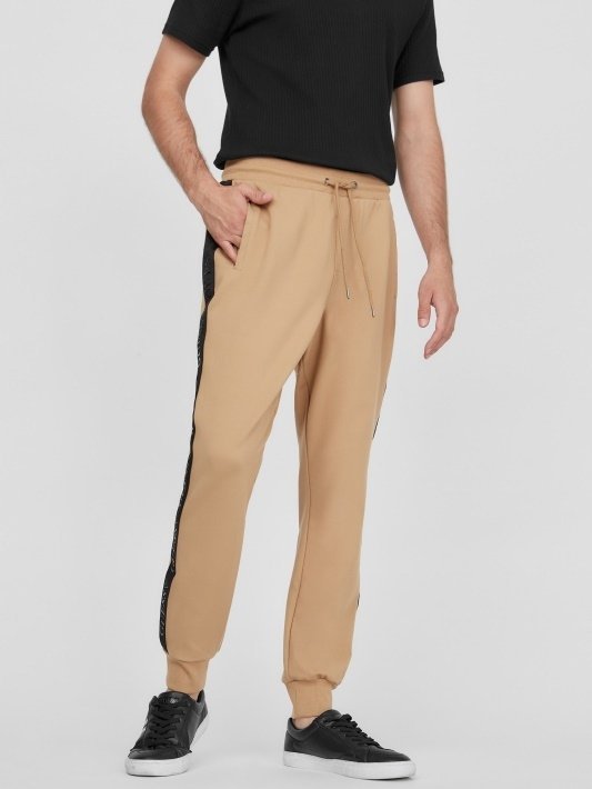 GUESS BEŻOWE SPODNIE DRESOWE Z CZARNYM LAMPASEM I MANKIETEM 3XL GGA