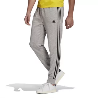 Spodnie sportowe męskie - Spodnie adidas Essentials French Terry Tapered Cuff 3-Stripes Pants GK8889 - szare - Adidas - grafika 1