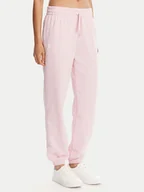 Spodnie sportowe damskie - Under Armour Spodnie dresowe Ua Rival 1382735 Różowy Loose Fit - miniaturka - grafika 1