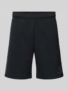Szorty z dzianiny dresowej o kroju tapered fit z nadrukiem z logo - Spodnie sportowe męskie - miniaturka - grafika 1