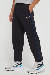Spodnie męskie - Reebok spodnie dresowe kolor czarny z aplikacją - grafika 1