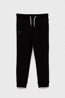 Spodnie damskie - Tommy Hilfiger Spodnie dziecięce kolor czarny z aplikacją - grafika 1