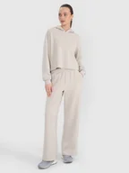 Spodnie sportowe damskie - 4F Spodnie dresowe z modalem z szerokimi nogawkami damskie - beżowe M - miniaturka - grafika 1
