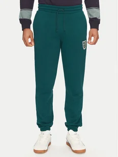 Puma Spodnie dresowe Sports Legacy Graphic 629631 Zielony Regular Fit - Spodnie sportowe męskie - miniaturka - grafika 1