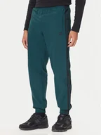 Spodnie sportowe męskie - adidas Spodnie dresowe adicolor Woven Firebird JY1335 Zielony Regular Fit - miniaturka - grafika 1